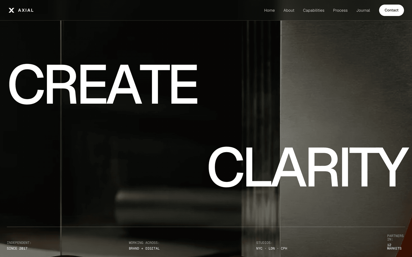 Axial - Hero loop with the converging CREATE / CLARITY headline